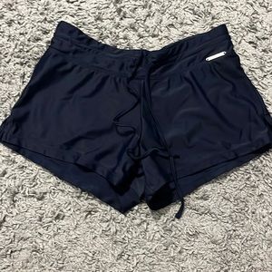Brand zero x posur. Navy blue girl swim shorts. Size xs.
